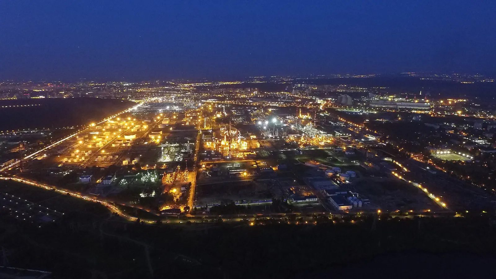 Aerial night view of the Moscow oil refinery and its illuminated processing units