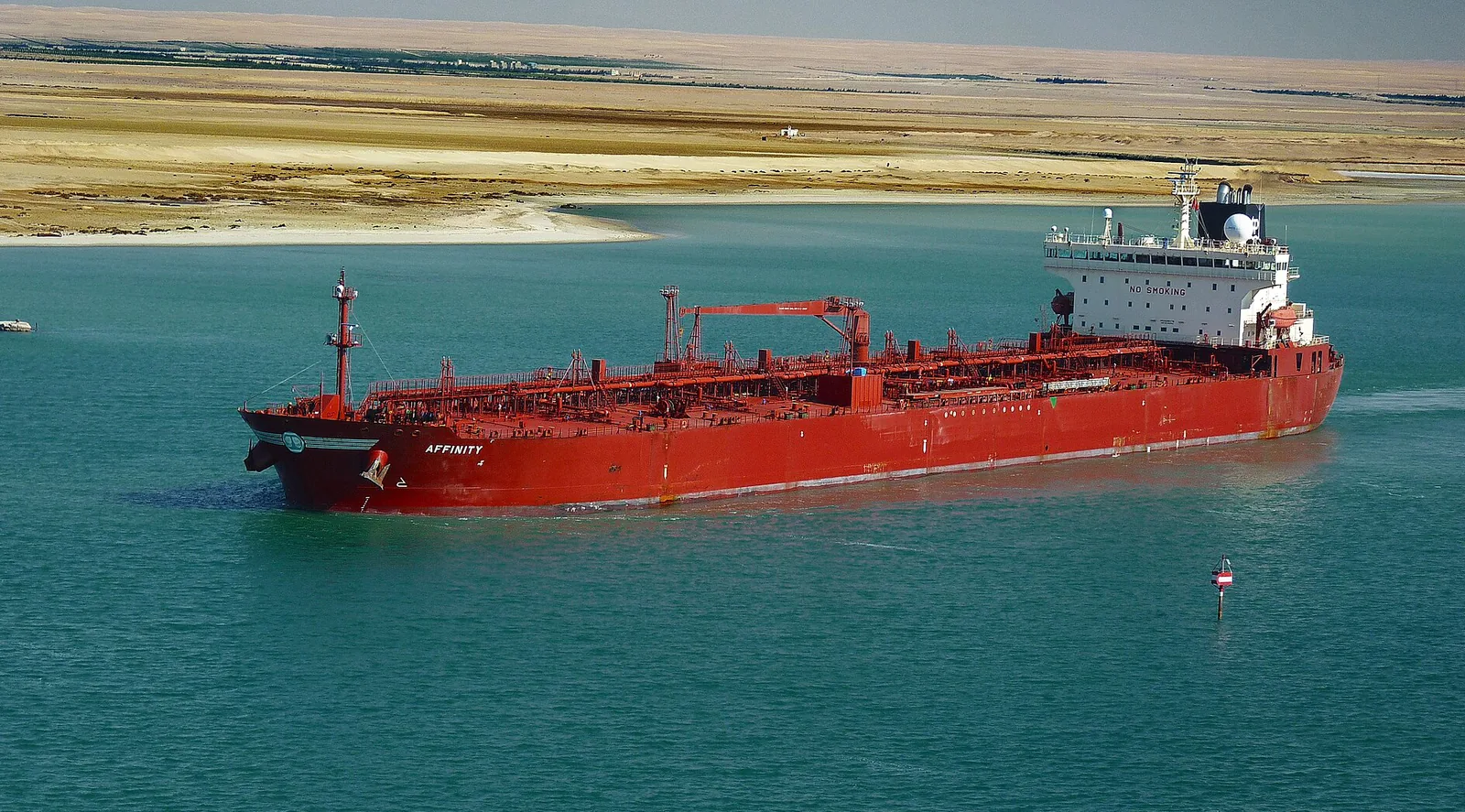 The red-hulled oil products tanker Affinity transiting the Suez Canal, the northern end of the Red Sea route