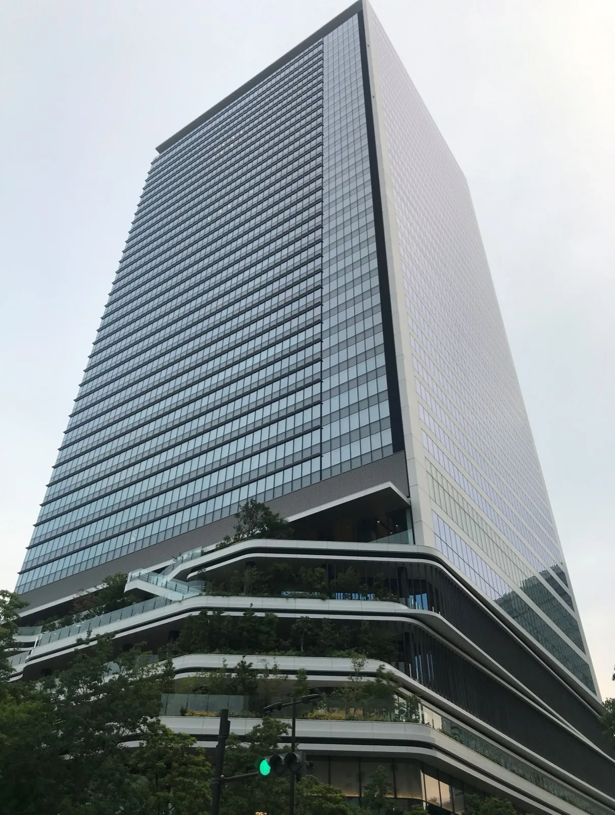 The glass-clad Tokyo Portcity Takeshiba office tower in Minato, Tokyo, with planted terraces on its lower floors